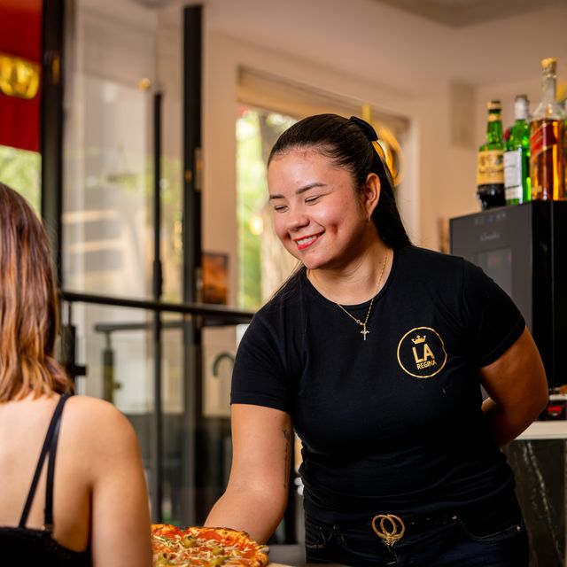 Restaurant staff attending to guests